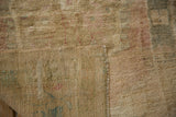 Distressed gold pile, woven foundation, and intact selvage of the vintage Oushak rug.