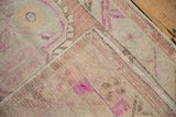 Back view of the distressed Oushak runner showing the hand-knotted foundation and wefts.