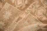 Close-up on the distressed Kars rug's low pile showing even wear and hand-knotted texture.
