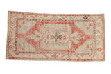 Vintage Distressed Oushak runner with faded cherry red, ivory, and pale slate blue medallion.