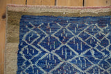 Distressed cobalt and indigo blue lattice pattern meets textured beige Oushak rug border.