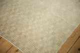Close-up on the shaggy, high-pile texture of a vintage distressed Turkish Tulu rug.