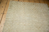 Tactile view of the plush, shaggy pile and hand-knotted foundation on a distressed Tulu rug.