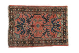 Vintage Mehreban rug with sprawling florals in sapphire blue and charcoal on a dusty blush field.