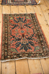 Vintage Mehreban rug from a side angle, displaying the sprawling floral design and borders.