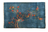 Vintage Chinese Art Deco rug, sprawling blush and saffron blossoms on sky blue field.