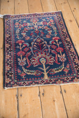 Angled perspective of a fine Persian Kerman rug with a central tree of life on a deep indigo field.