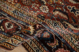 A folded view showing the mostly even wear and dense hand-knotted pile of an antique Qashqai rug.