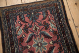 Vintage Bibikabad rug's intact side selvage, boteh border, and cochineal floral field.