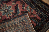 Vintage Persian Bibikabad rug with dusty red floral pile and tight hand-knotted foundation.