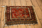 Antique Northwest Persian rug corner, madder red field, Herati motifs, stepped serrated leaf border.