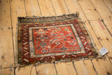 Antique Northwest Persian rug corner detailing a stepped serrated leaf border and tattered fringe.