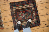 Jaff Kurd square rug, central hook-and-latch guls, vibrant blue, red, ivory borders, tattered edges.