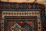 Visible hook-and-latch guls, interconnected seed border, and minor restoration on antique rug.