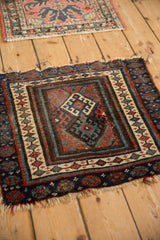 Jaff Kurd antique rug corner: hook-and-latch guls, seed border, and tattered edges.