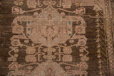 Distressed Anatolian carpet with worn foundation, stylized Samovar motifs in chocolate brown, dusty rose.