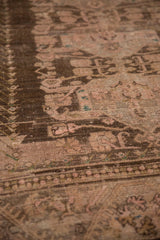 Distressed Anatolian carpet pile showing worn foundation, chocolate brown, ivory, and dusty rose.