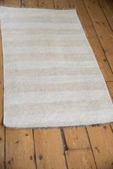 Textured plain-weave of a vintage Turkish Kilim rug with ivory, platinum, and beige abrash.