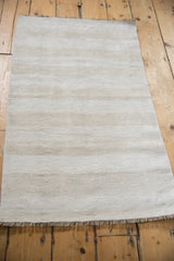 Vintage hemp kilim featuring plain-weave texture and soft neutral abrashes.