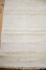 Plain-weave Turkish hemp kilim texture with natural ivory, platinum, and beige abrashes.