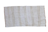 Vintage hemp kilim rug with a plain-weave texture and vertical stripes in ivory and beige.