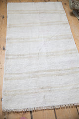 Vintage hemp kilim rug showing its full length and subtle, natural-toned stripes.