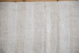 Plain-weave texture of a vintage Turkish Hemp Kilim rug in ivory, platinum, oxidized silver.