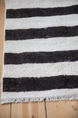 Textured plain-weave Turkish Hemp Kilim rug with platinum, ivory, charcoal stripes and fringe.