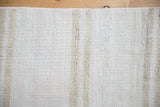 Plain-weave texture of vintage Turkish hemp kilim with ivory, platinum, and beige abrashes.