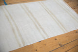 Detailed view of plain-weave vintage hemp kilim with natural ivory and beige abrashes.