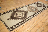 Vintage Kurd runner's central medallion with sharp lightning contour, visible knot head wear.