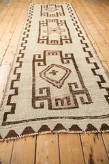 Original brocade selvage, ivory, and chocolate geometric border on vintage Kurd runner.