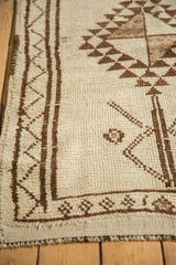 Close-up of vintage Kurd runner, showing shorn pile with ivory and dark chocolate brown geometric patterns.