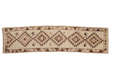 Vintage Kurd runner with concentric serrated gul medallions and animal motifs in brown and ivory.