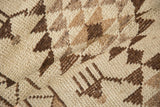 A close view of the vintage Kurd rug's evenly worn, shorn pile and hand-knotted texture.