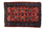 Vintage Lilihan rug with a floral allover design in gem-like ruby red and sapphire blue.