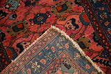 Folded corner of a vintage Lilihan rug revealing its hand-knotted foundation and wool pile.