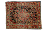 Vintage Josan Sarouk square rug with a scalloped medallion on a dark navy field of intricate cherry red vines.