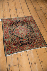 Overhead view of a traditional Josan Sarouk mat, showing its intricate floral patterns and central medallion.