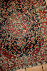 Scalloped floral motifs and interconnecting vines on a vintage Josan Sarouk rug with a low, even pile.