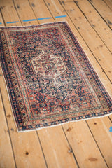 Antique Senneh rug's Herati motif, diamond finial, navy, red, beige, with foundation wear.