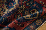 Low pile texture and floral cross-section border of an antique Malayer rug.