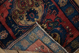 Fine hand-knotted construction shown on the folded corner of an antique Persian Malayer rug.