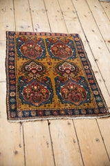 High-angle view of the antique Farahan Sarouk rug showing its full multi-medallion pattern on a gold field.