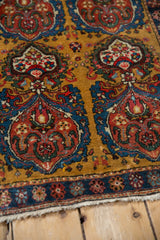 Corner detail of an antique Farahan Sarouk showing the intricate cloud-band motifs and floral border.