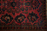 Close view of a vintage Sarouk rug's unusual field panel showing an intricate fish drawing.