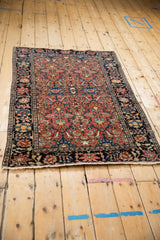 Full length perspective of an antique Farahan Sarouk rug with its intricate all-over design.