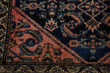 Corner detail of the vintage Lilihan rug, showing Herati design in cobalt blue, blush pink, and teal.