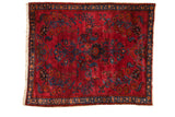 Lustrous vintage Lilihan square rug, raspberry red field, sapphire blue floral motifs.