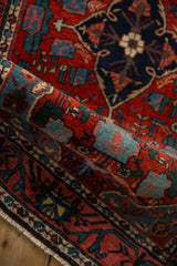 A rolled portion of the vintage Bijar rug showing its plush, even pile and dense weave.
